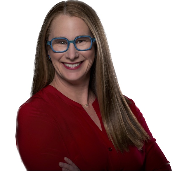 Studio headshot of Beth Rudden in blue glasses and a red top.